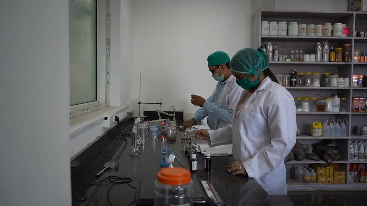Analysts carrying out quality checks in the laboratory
